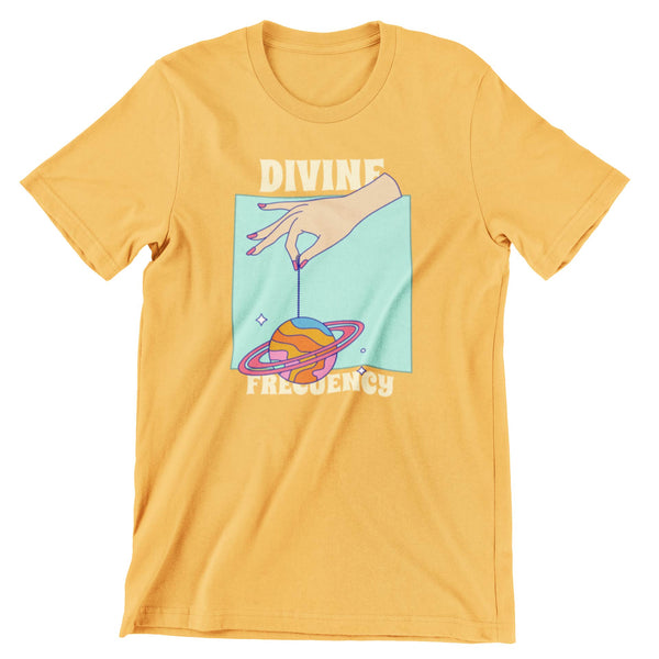 Antique Gold t-shirt that shows a hand holding a planet by a string that says divine frequency.
