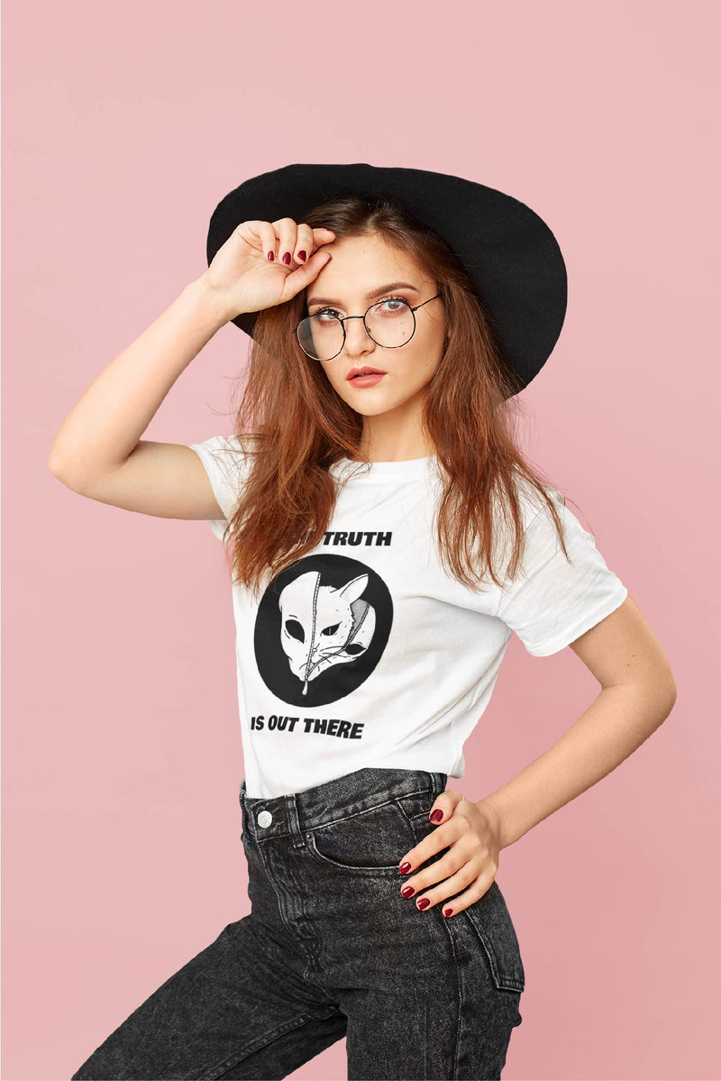 Woman wearing white short sleeve t-shirt with half of an alien's face unzipped showing half of a cats face with the words, the truth is out there.