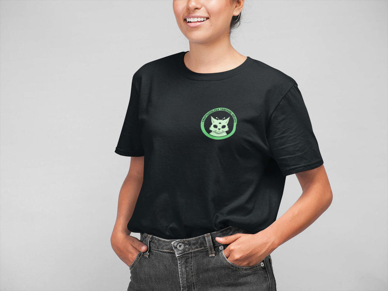 woman in black short sleeve shirt with cryptozoology alien cat logo printed on the left crest. 